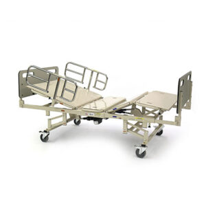 A hospital bed with wheels and rails on the side.